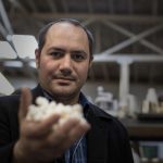 Anthony Di Franco holds a 3-D printed model of an insulin molecule at Counter Culture Labs in Oakland.