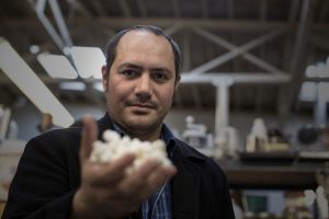 Anthony Di Franco holds a 3-D printed model of an insulin molecule at Counter Culture Labs in Oakland.